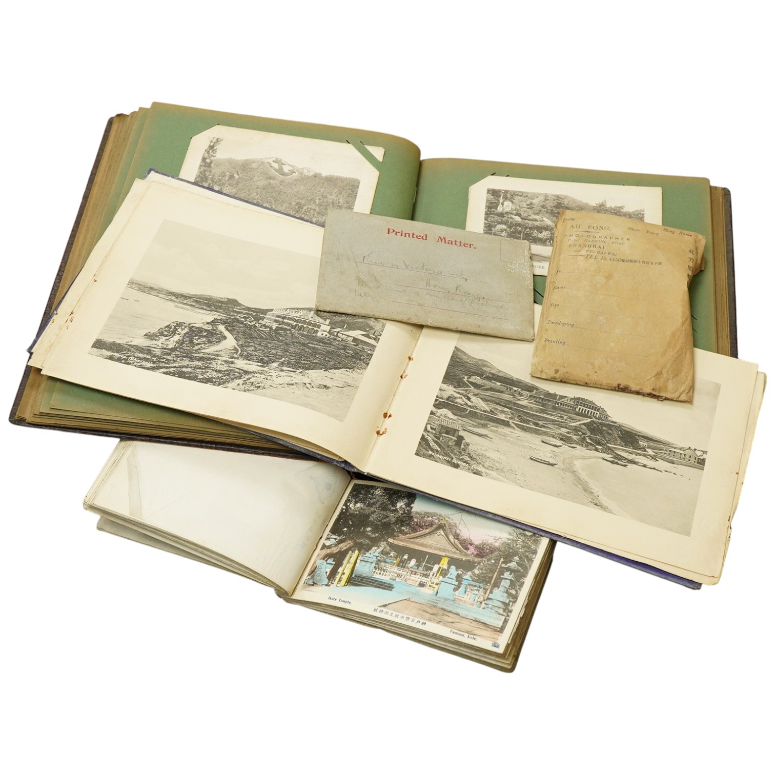 An early 20th century photograph and postcard album of Chinese and Japanese scenes, together with some negatives, etc.